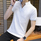 Cotton polo shirt in white color with short sleeves, showcased on a model indoors.